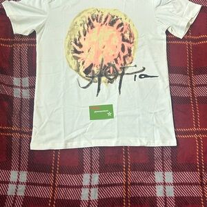 Travis Scott Kids Cream Tee with Orange and Black Design